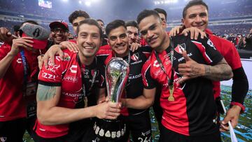 GUADALAJARA, MEXICO - DECEMBER 12: Mart&iacute;n Nervo, Edgar Zald&iacute;var and Anderson Santamar&iacute;a of Atlas pose with the trophy after the final second leg match between Atlas and Leon as part of the Torneo Grita Mexico A21 Liga MX at Jalisco St