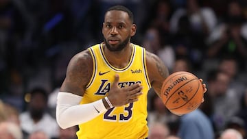 (FILES) In this file photo taken on November 1, 2019 LeBron James #23 of the Los Angeles Lakers dribbles the ball at American Airlines Center in Dallas, Texas. - LeBron James scored 30 points, grabbed 10 rebounds and passed off 11 assists on November 5, leading the Los Angeles Lakers to a 118-112 comeback NBA victory at Chicago with his third consecutive triple double. (Photo by RONALD MARTINEZ / GETTY IMAGES NORTH AMERICA / AFP)