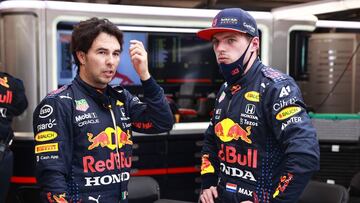BUDAPEST, HUNGARY - AUGUST 01: Max Verstappen of Netherlands and Red Bull Racing and Sergio Perez of Mexico and Red Bull Racing talk in the garage during the red flag delay during the F1 Grand Prix of Hungary at Hungaroring on August 01, 2021 in Budapest, Hungary. (Photo by Mark Thompson/Getty Images) // Getty Images / Red Bull Content Pool // SI202108010232 // Usage for editorial use only //