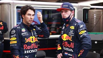BUDAPEST, HUNGARY - AUGUST 01: Max Verstappen of Netherlands and Red Bull Racing and Sergio Perez of Mexico and Red Bull Racing talk in the garage during the red flag delay during the F1 Grand Prix of Hungary at Hungaroring on August 01, 2021 in Budapest, Hungary. (Photo by Mark Thompson/Getty Images) // Getty Images / Red Bull Content Pool  // SI202108010232 // Usage for editorial use only // 