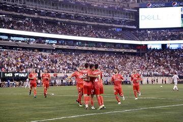 Real Madrid's players celebrate with Asensio.