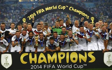 Germany players celebrate with their trophy after winning the 2014 World Cup final between Germany and Argentina at the Maracana stadium in Rio de Janeiro July 13, 2014. (Darren Staples/Reuters)