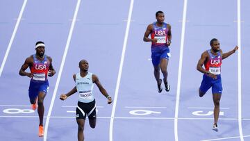 Botswana's Letsile Tebogo, US' Kenneth Bednarek and US' Noah Lyles cross the finish line to finish first, second and third respectively in the men's 200m final of the athletics event at the Paris 2024 Olympic Games at Stade de France in Saint-Denis, north of Paris, on August 8, 2024. (Photo by Odd ANDERSEN / AFP)