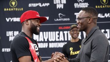 LAS VEGAS, NEVADA - OCTOBER 13: Floyd Mayweather Jr. (L) and Deji Olatunji shake hands during a news conference at the Mayweather Boxing Club on October 13, 2022 in Las Vegas, Nevada. Mayweather is scheduled to fight Olatunji in an exhibition match in Dubai on November 13, 2022. Steve Marcus/Getty Images/AFP