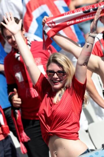 An Austrian supporter cheers before the Euro 2016 group F football match between Iceland and Austria at the Stade de France stadium in Saint-Denis, near Paris on June 22, 2016. / AFP PHOTO / KENZO TRIBOUILLARD