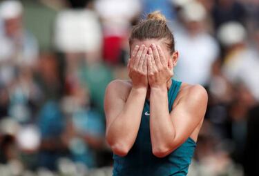 Relieved Halep fights off nerves to end grand-slam wait