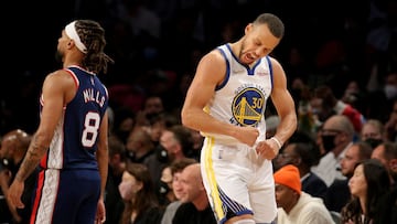 Nov 16, 2021; Brooklyn, New York, USA; Golden State Warriors guard Stephen Curry (30) reacts in front of Brooklyn Nets guard Patty Mills (8) during the fourth quarter at Barclays Center. Mandatory Credit: Brad Penner-USA TODAY Sports