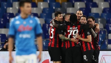 22 November 2020, Italy, Naples: Milan's Zlatan Ibrahimovic celebrates scoring his side's first goal with teammates during the Italian serie A soccer match between Napoli and AC Milan at the San Paolo stadium. The red mark on Ibrahimovic's