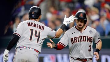 ARLINGTON, TEXAS - OCTOBER 28: Gabriel Moreno #14 and Evan Longoria #3 of the Arizona Diamondbacks celebrate after Longoria scored a run in the seventh inning against the Texas Rangers during Game Two of the World Series at Globe Life Field on October 28, 2023 in Arlington, Texas. Carmen Mandato/Getty Images/AFP (Photo by Carmen Mandato / GETTY IMAGES NORTH AMERICA / Getty Images via AFP)