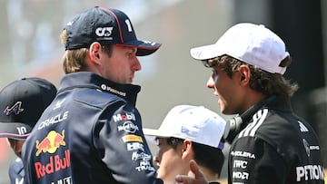 Red Bull Racing's Dutch driver Max Verstappen (L) and Mercedes' Italian driver Andrea Kimi Antonelli take part in the drivers' parade before the start of the Formula One Chinese Grand Prix at the Shanghai International Circuit in Shanghai on March 23, 2025. (Photo by GREG BAKER / AFP)