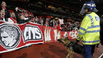 Police inside the stadium keep an eye on Cologne supporters in the stands as the kick off is delayed due to crowd safety issues ahead of the UEFA Europa League Group H football match between Arsenal and FC Cologne at The Emirates Stadium in London on Sept