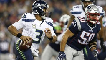 Nov 13, 2016; Foxborough, MA, USA; Seattle Seahawks quarterback Russell Wilson (3) is forced out of the pocket by New England Patriots outside linebacker Rob Ninkovich (50) during the first quarter at Gillette Stadium. Mandatory Credit: Greg M. Cooper-USA TODAY Sports