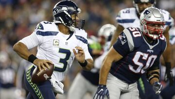 Nov 13, 2016; Foxborough, MA, USA;  Seattle Seahawks quarterback Russell Wilson (3) is forced out of the pocket by New England Patriots outside linebacker Rob Ninkovich (50)  during the first quarter at Gillette Stadium. Mandatory Credit: Greg M. Cooper-USA TODAY Sports