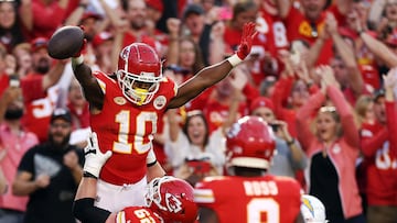 KANSAS CITY, MISSOURI - OCTOBER 22: Isiah Pacheco #10 of the Kansas City Chiefs celebrates with Joe Thuney #62 after a touchdown during the fourth quarter of the game against the Los Angeles Chargers at GEHA Field at Arrowhead Stadium on October 22, 2023 in Kansas City, Missouri.   Jamie Squire/Getty Images/AFP (Photo by JAMIE SQUIRE / GETTY IMAGES NORTH AMERICA / Getty Images via AFP)