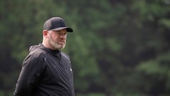 (FILES) Wayne Rooney, Major League Soccer (MLS) All Stars Coach and current DC United Coach, walks on the pitch during a Major League Soccer (MLS) All Stars training session at American University in Washington, DC, on July 17, 2023. Former England international Wayne Rooney is leaving his position as head coach of Major League Soccer's DC United after the team missed out on a spot in the playoffs on October 7, 2023. (Photo by Jim WATSON / AFP)