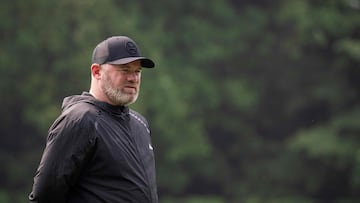 (FILES) Wayne Rooney, Major League Soccer (MLS) All Stars Coach and current DC United Coach, walks on the pitch during a Major League Soccer (MLS) All Stars training session at American University in Washington, DC, on July 17, 2023. Former England international Wayne Rooney is leaving his position as head coach of Major League Soccer's DC United after the team missed out on a spot in the playoffs on October 7, 2023. (Photo by Jim WATSON / AFP)