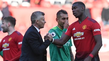 Ole Gunnar Solskjaer y Paul Pogba.