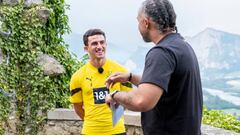 BAD RAGAZ, SWITZERLAND - JULY 20: Mateu Morey and Patrick Owomoyela of Borussia Dortmund during an interview near the Borussia Dortmund Training Camp in Bad Ragaz on July 20, 2022 in Bad Ragaz, Switzerland. (Photo by Alexandre Simoes/Borussia Dortmund via Getty Images)