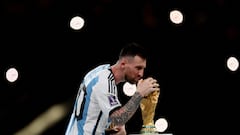 Soccer Football - FIFA World Cup Qatar 2022 - Final - Argentina v France - Lusail Stadium, Lusail, Qatar - December 18, 2022 Argentina's Lionel Messi celebrates with the trophy after winning the World Cup REUTERS/Lee Smith