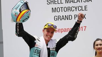 Spain's Moto3 rider Joan Mir celebrates after winning the Malaysia Moto3 race at the Sepang International circuit in Sepang, Malaysia, Sunday, Oct. 29, 2017. (AP Photo/Vincent Thian)