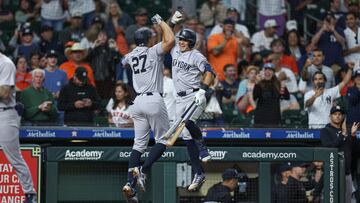 Mar 29, 2024; Houston, Texas, USA; New York Yankees designated hitter Giancarlo Stanton (27) celebrates with shortstop Anthony Volpe (11) after hitting a home run during the ninth inning against the Houston Astros at Minute Maid Park. Mandatory Credit: Troy Taormina-USA TODAY Sports