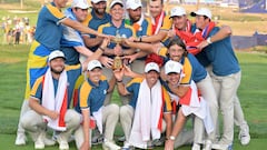 Team Europe captain Luke Donald (C) and his players pose with the trophy after winning the 2023 Ryder Cup golf tournament in Guidonia, near Rome, Italy.