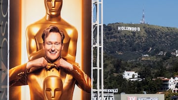 A large billboard sign featuring this year's Oscar host Conan O'Brien towers over Hollywood blvd as workers prepare for the 98th Academy Awards in Los Angeles, California, U.S., March 9, 2026. REUTERS/Daniel Cole