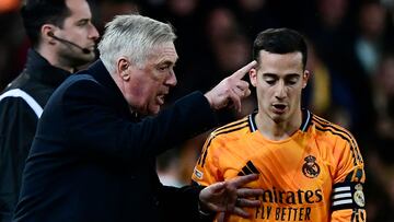 Real Madrid's Italian coach Carlo Ancelotti gives instructions to Real Madrid's Spanish defender #17 Lucas Vazquez during the Spanish league football match between Valencia CF and Real Madrid CF at the Mestalla stadium in Valencia on January 3, 2025. (Photo by JOSE JORDAN / AFP)