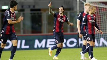 Bologna's Roberto Soriano, center, celebrates the second goal during a Serie A soccer match between Bologna and Parma, at the Renato Dall’Ara stadium, in Bologna, Italy, Monday, Sept. 28, 2020. (Filippo Rubin/LaPresse via AP)