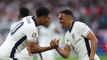 GELSENKIRCHEN, GERMANY - JUNE 16: Jude Bellingham of England celebrates scoring his team's first goal with teammate Trent Alexander-Arnold during the UEFA EURO 2024 group stage match between Serbia and England at Arena AufSchalke on June 16, 2024 in Gelsenkirchen, Germany. (Photo by Eddie Keogh - The FA/The FA via Getty Images)