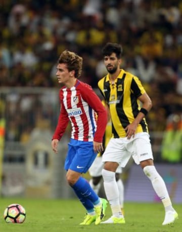 Atletico Madrid's French forward Antoine Griezmann looks to pass during their friendly match marking the anniversary of the Saudi team, at the King Abdullah Sports City stadium in Jeddah on December 30, 2016.