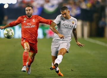 Dani Carvajal tussles with Roma's Aleksandar Kolarov.