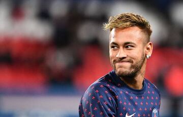 Brazilian forward Neymar smiles during warm up prior to the French L1 football match between Paris Saint-Germain (PSG) and Olympique de Lyon