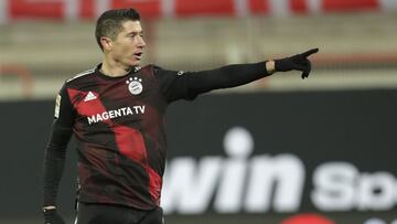 Bayern&#039;s Robert Lewandowski celebrates after scoring his sides first goal during the German Bundesliga soccer match between 1.FC Union Berlin and FC Bayern Munich in Berlin, Germany, Saturday, Dec. 12, 2020. (AP Photo/Michael Sohn, pool)