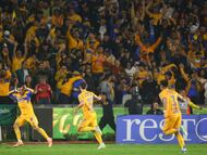 Tigres' Argentine midfielder #11 Juan Brunetta (C) celebrates scoring his team's first goal during the Liga MX Apertura semifinal second leg football match between Tigres and Cruz Azul at the UANL University Stadium in San Nicolas de los Garza, Nuevo Leon State, Mexico on December 6, 2025. (Photo by Julio Cesar AGUILAR / AFP)