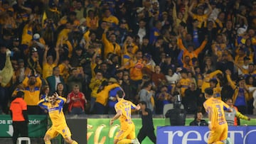 Tigres' Argentine midfielder #11 Juan Brunetta (C) celebrates scoring his team's first goal during the Liga MX Apertura semifinal second leg football match between Tigres and Cruz Azul at the UANL University Stadium in San Nicolas de los Garza, Nuevo Leon State, Mexico on December 6, 2025. (Photo by Julio Cesar AGUILAR / AFP)