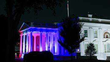 The White House is lit in red, white and blue in honor of the Olympic Games, in Washington, U.S.,  July 23, 2021. REUTERS/Evelyn Hockstein