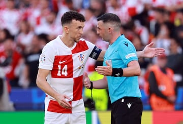 Perisic (left) remonstrates with referee Michael Oliver.
