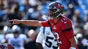 CHARLOTTE, NORTH CAROLINA - OCTOBER 23: Tom Brady #12 of the Tampa Bay Buccaneers directs the offense in the first quarter against the Carolina Panthers at Bank of America Stadium on October 23, 2022 in Charlotte, North Carolina.   Eakin Howard/Getty Images/AFP