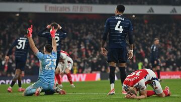 Arsenal's Belgian midfielder #19 Leandro Trossard (R) reacts after missing a chance during the English Premier League football match between Arsenal and Aston Villa at the Emirates Stadium in London on January 18, 2025. (Photo by Glyn KIRK / AFP) / RESTRICTED TO EDITORIAL USE. No use with unauthorized audio, video, data, fixture lists, club/league logos or 'live' services. Online in-match use limited to 120 images. An additional 40 images may be used in extra time. No video emulation. Social media in-match use limited to 120 images. An additional 40 images may be used in extra time. No use in betting publications, games or single club/league/player publications. /