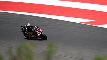 Aprilia Racing team's Italian MotoGP rider Marco Bezzecchi rides during the qualifying session ahead of the MotoGP Indonesian Grand Prix at the Mandalika International Circuit in Mandalika, West Nusa Tenggara on October 4, 2025. (Photo by SONNY TUMBELAKA / AFP)