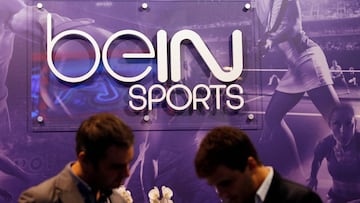 FILE PHOTO: Visitors are seen at the French TV channel 'beIN Sport' stand during the Sportel in Monte Carlo October 8, 2014. Picture taken October 8, 2014. REUTERS/Eric Gaillard/File Photo