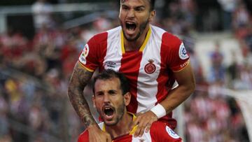 Stuani y Portu, jugador del Girona.