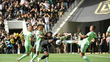 LOS ANGELES, CA - OCTOBER 30: Jose Cifuentes #20 of Los Angeles FC makes a shot on goal but is blocked by Ruben Gabrielsen #4 and Julio Cascante #18 of Austin FC during the first half of the Western Conference Finals of the 2022 MLS Cup Playoffs at Banc of California Stadium on October 30, 2022 in Los Angeles, California. (Photo by Kevork Djansezian/Getty Images)