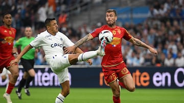 Marseille's Chilean forward Alexis Sanchez (L) vies for the ball with Angers' Slovenian defender Miha Blazic during the French L1 football match between Olympique Marseille (OM) and SCO Angers at Stade Velodrome in Marseille, southern France on May 14, 2023. (Photo by Nicolas TUCAT / AFP)