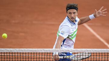 France's Arthur Rinderknech plays a backhand return to Argentina's Tomas Martin Etcheverry during their men's singles match on day five of the French Open tennis tournament at the Roland Garros Complex in Paris on May 30, 2024. (Photo by Bertrand GUAY / AFP)