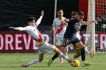 Real Madrid's Spanish forward #17 Lucas Vazquez vies with Rayo Vallecano's Spanish midfielder #23 Oscar Valentin during the Spanish league football match Rayo Vallecano de Madrid and Real Madrid CF at the Vallecas stadium in Madrid on February 18, 2024. (Photo by Pierre-Philippe MARCOU / AFP)