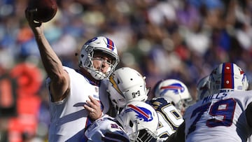 Nov 19, 2017; Carson, CA, USA; Buffalo Bills quarterback Nathan Peterman (2) throws an interception as he his hit by Los Angeles Chargers defensive end Joey Bosa (99) during the second quarter at StubHub Center. Mandatory Credit: Kelvin Kuo-USA TODAY Sports