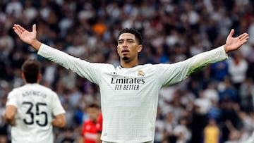 Real Madrid's English midfielder #05 Jude Bellingham celebrates scoring his team's second goal during the Spanish league football match between Real Madrid CF and CA Osasuna at the Santiago Bernabeu stadium in Madrid on November 9, 2024. (Photo by OSCAR DEL POZO / AFP)