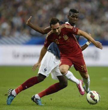 Santiago Cazorla y Paul Pogba.